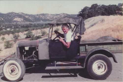 Ed Fitts enjoying a favorite auto.